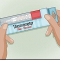 Ved hjelp av et glasstermometer